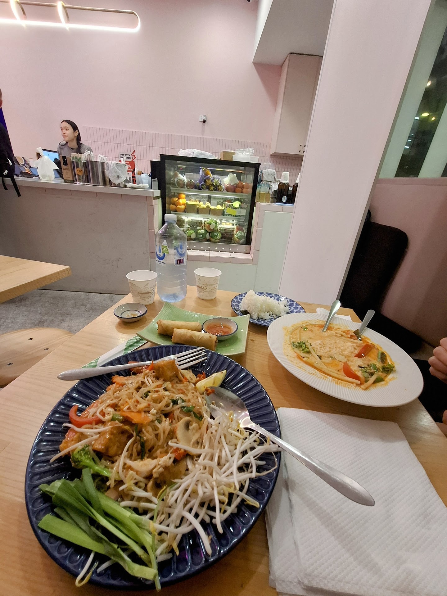Metro Thai dishes with curry, stir fry, rice, and fruit bowl